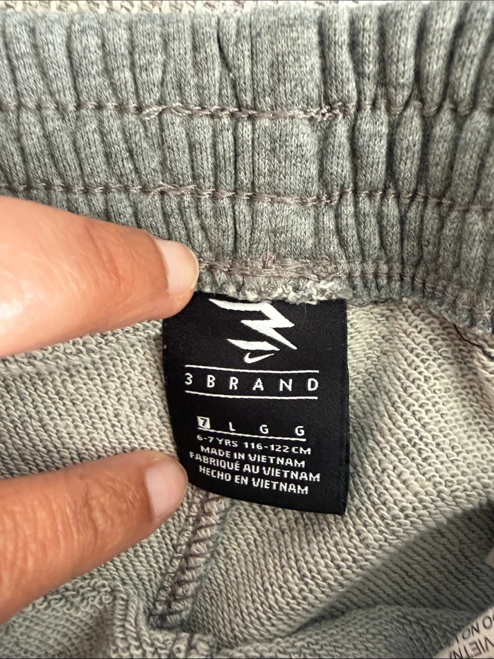 Two Pairs of Nike Gray Athletic Shorts with Graphic Logo